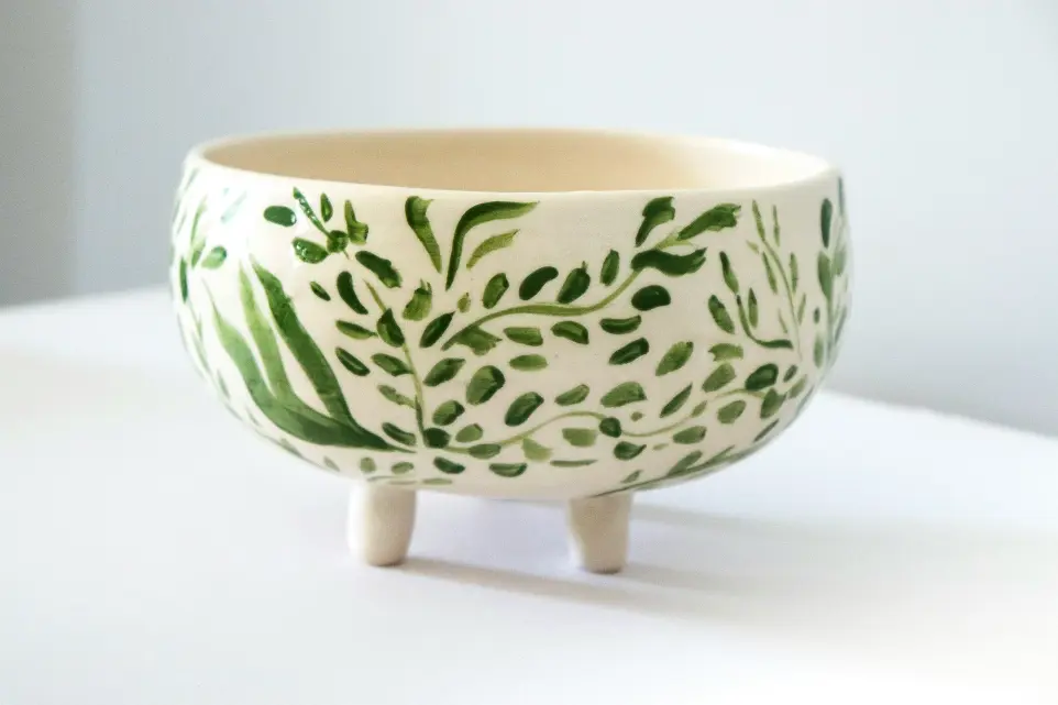 footed white and green floral bowl