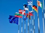 a bunch of flags that are flying in the air