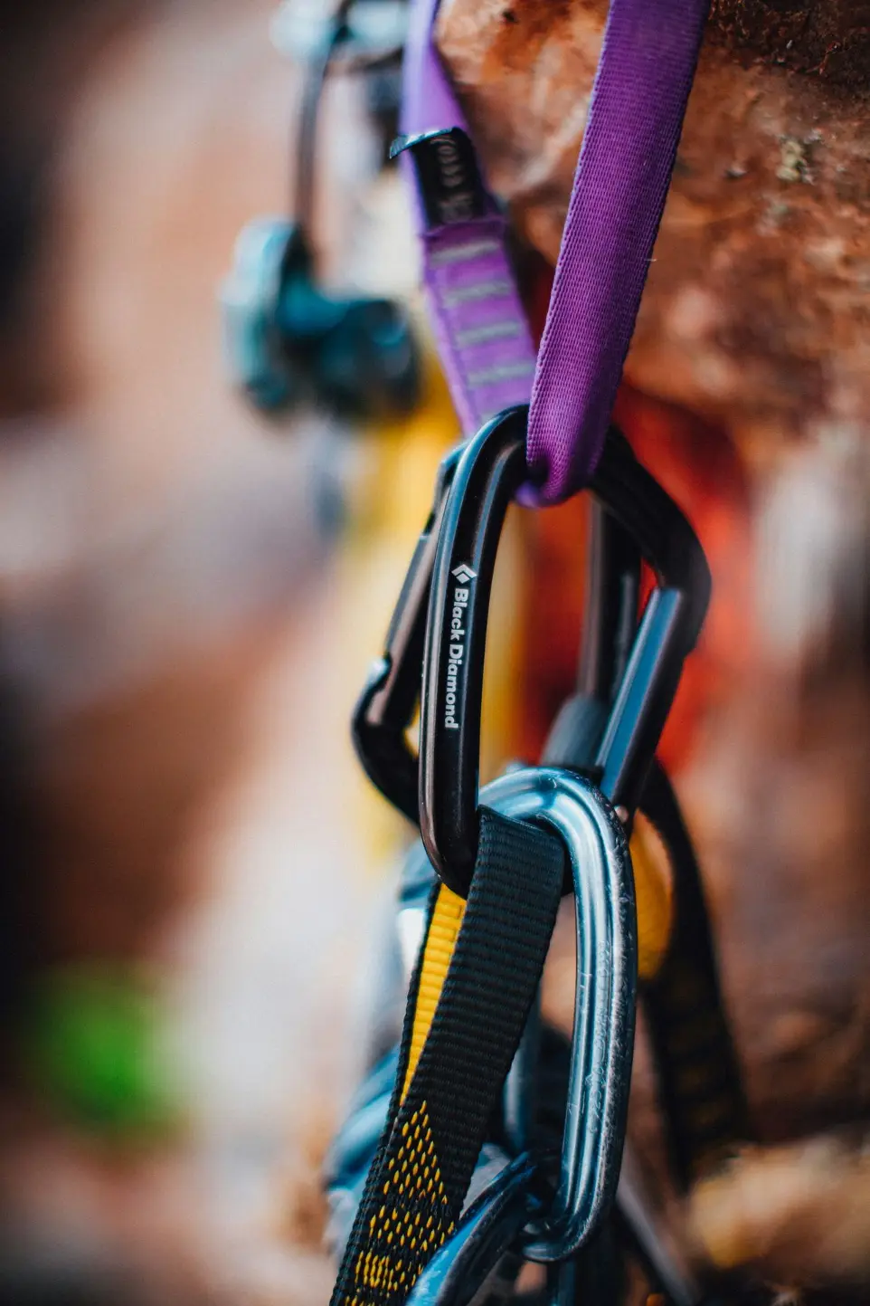 purple and black strap on brown wooden surface