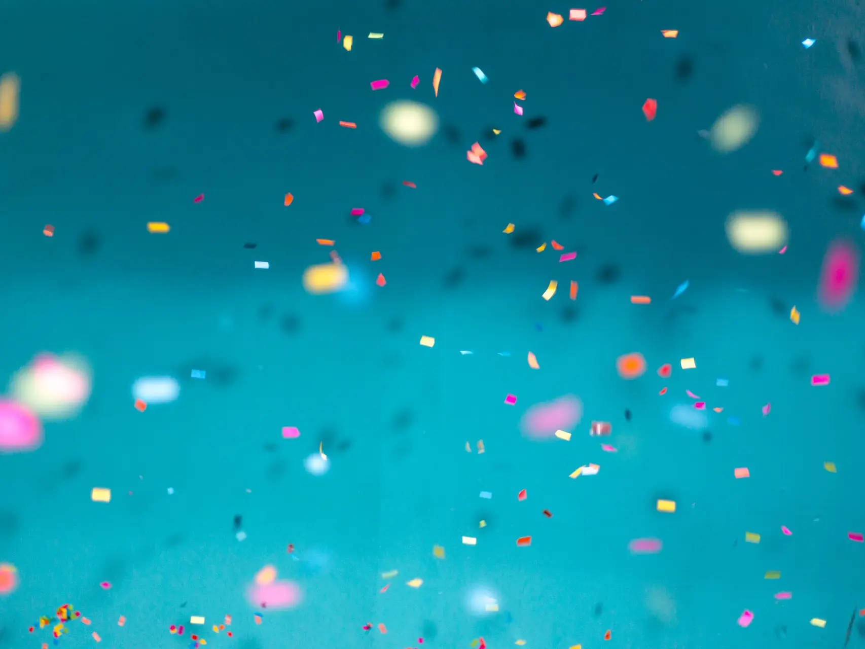 selective focus photography of multicolored confetti lot