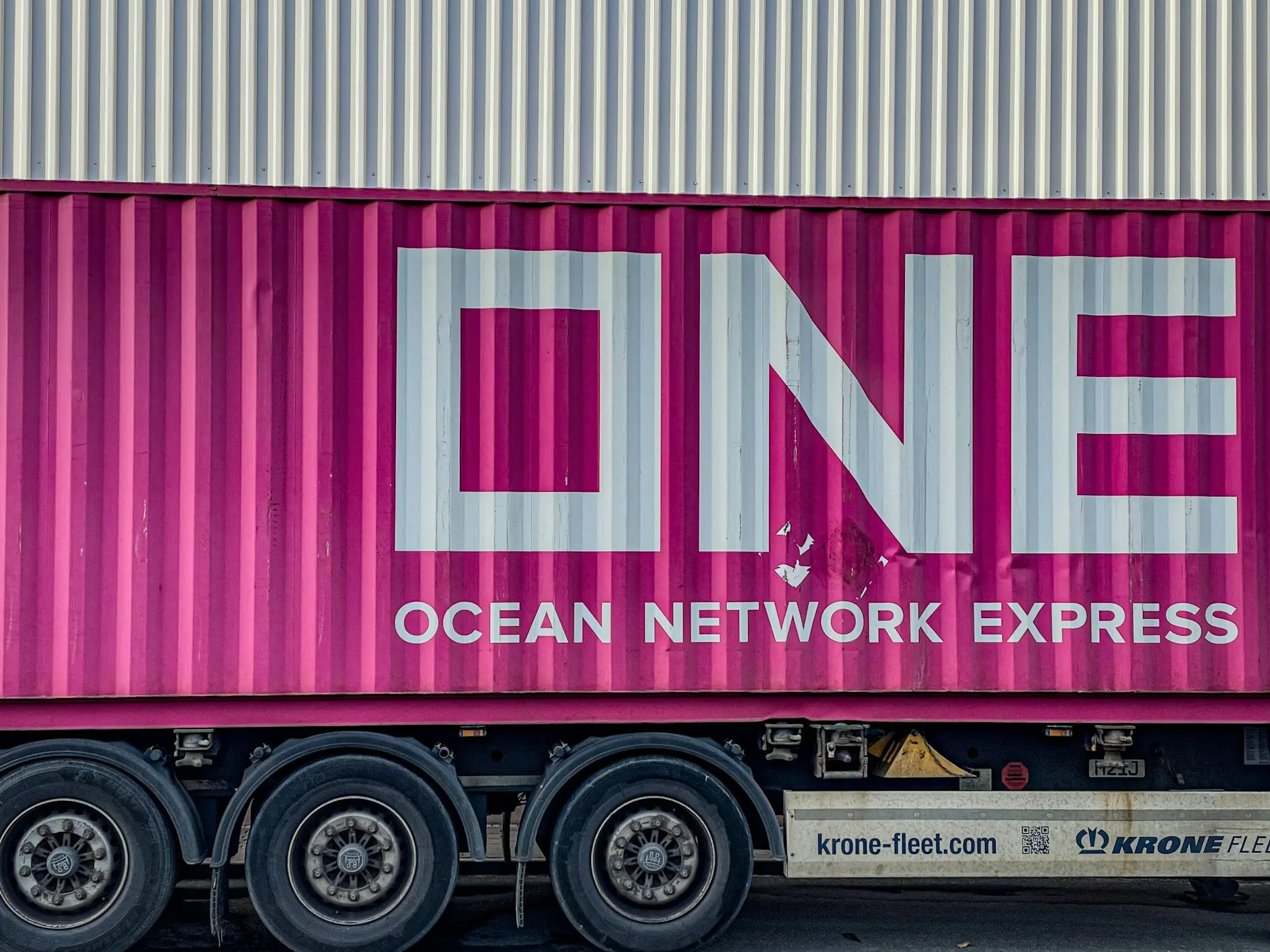 a pink truck with the word ocean network express painted on it